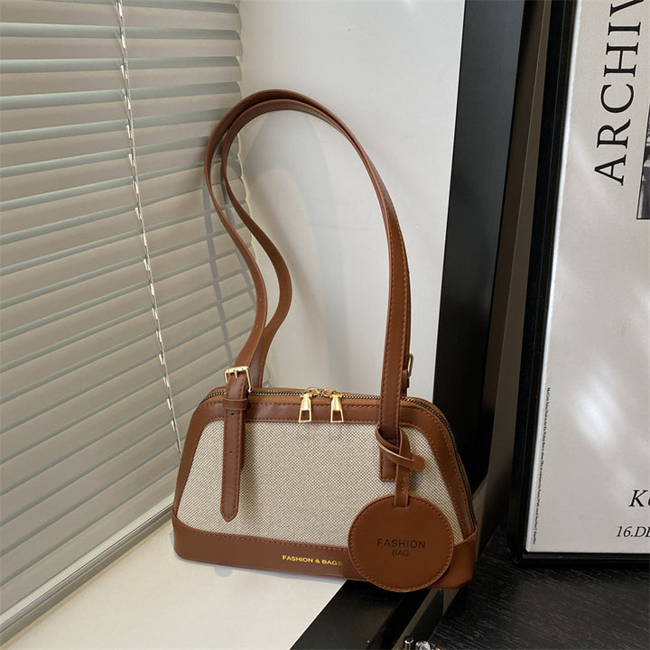 Damen Umhängetasche mit strukturiertem Gewebe und elegantem Detail Nord Taschen