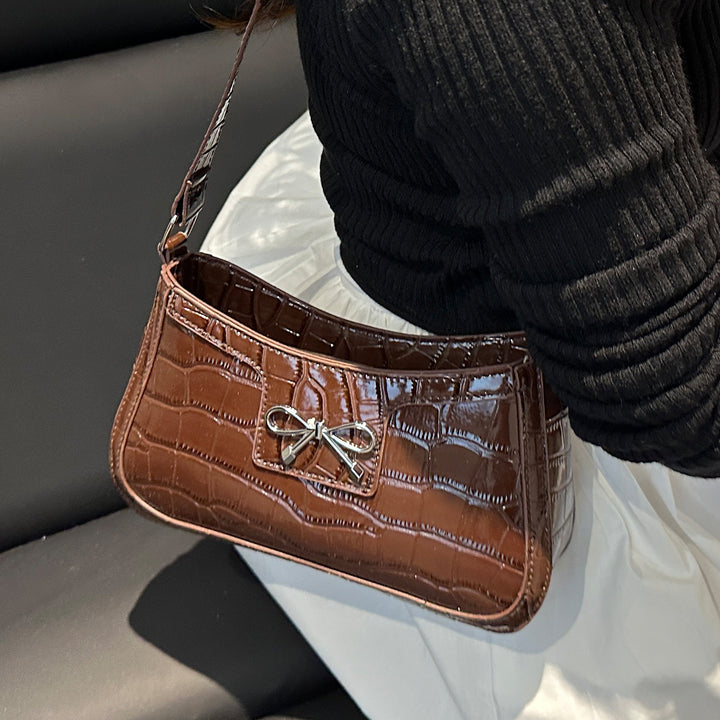 Damen elegante Handtasche mit Krokodilprägung und charmantem Schleifendetail Nord Taschen