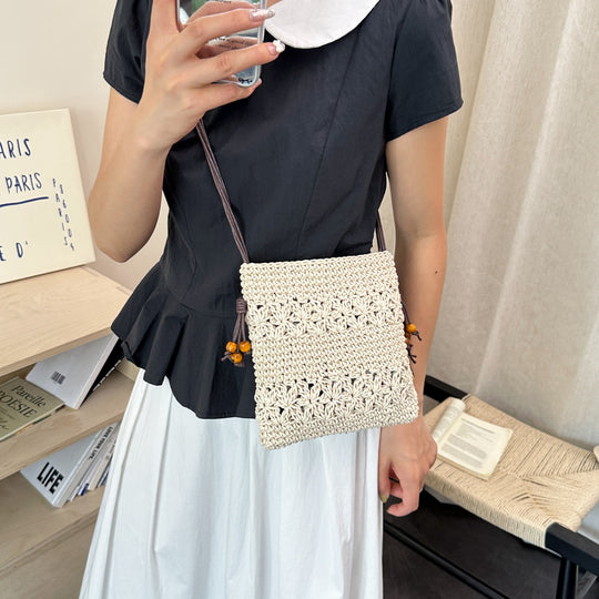 Damenhandtasche aus handgewebtem Naturmaterial mit verspielten Details Nord Taschen