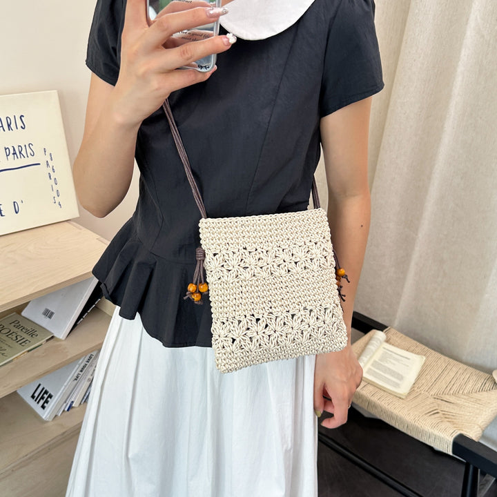 Damenhandtasche aus handgewebtem Naturmaterial mit verspielten Details Nord Taschen