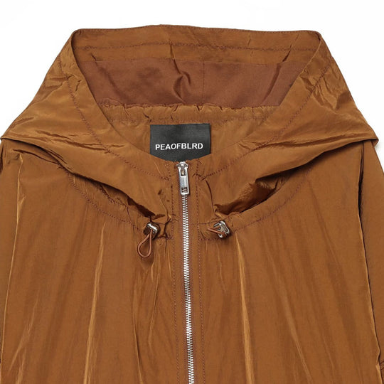 Damen Leichte Kapuzen‑Windjacke aus glänzendem Nylon mit Tunnelzug und Zwei‑Wege‑Reißverschluss Nord Taschen