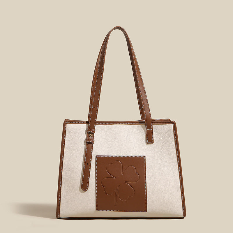 Damen elegante Tote-Tasche mit strukturiertem Leder und verspieltem Kleeblatt-Akzent Nord Taschen