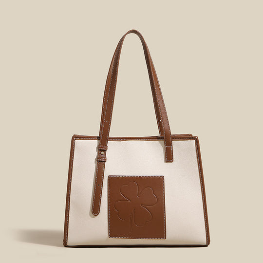 Damen elegante Tote-Tasche mit strukturiertem Leder und verspieltem Kleeblatt-Akzent Nord Taschen