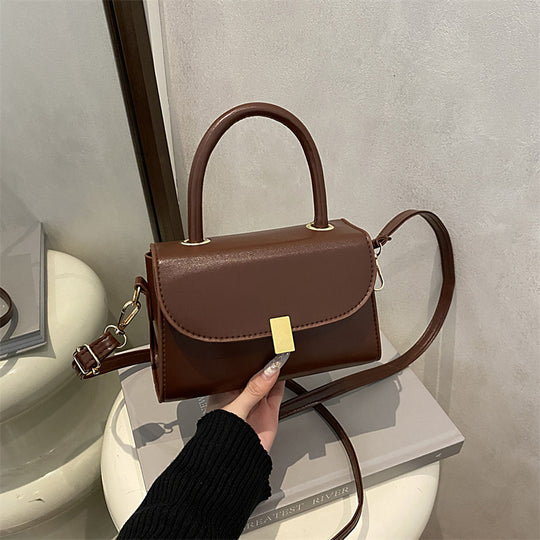 Damen-Handtasche mit abnehmbarem Schulterriemen und eleganter Verschlussmechanik Nord Taschen
