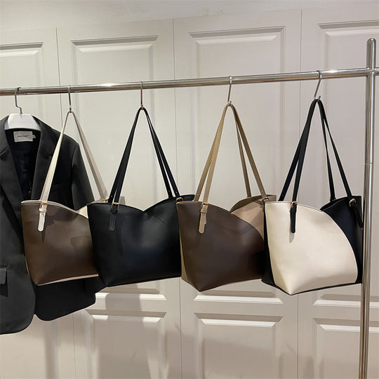 Damen elegante Handtasche mit asymmetrischem Design und robusten Trageriemen Nord Taschen