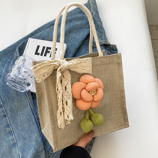 Damen Jute-Handtasche mit floralem Akzent und dekorativem Schleifenband Nord Taschen