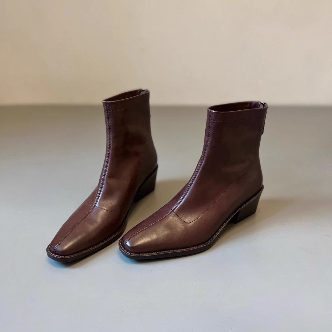 Damen Knöchelhohe Glattleder‑Stiefelette mit sculpted Keilabsatz Nord Taschen