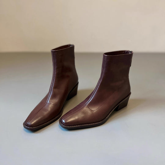 Damen Knöchelhohe Glattleder‑Stiefelette mit sculpted Keilabsatz Nord Taschen