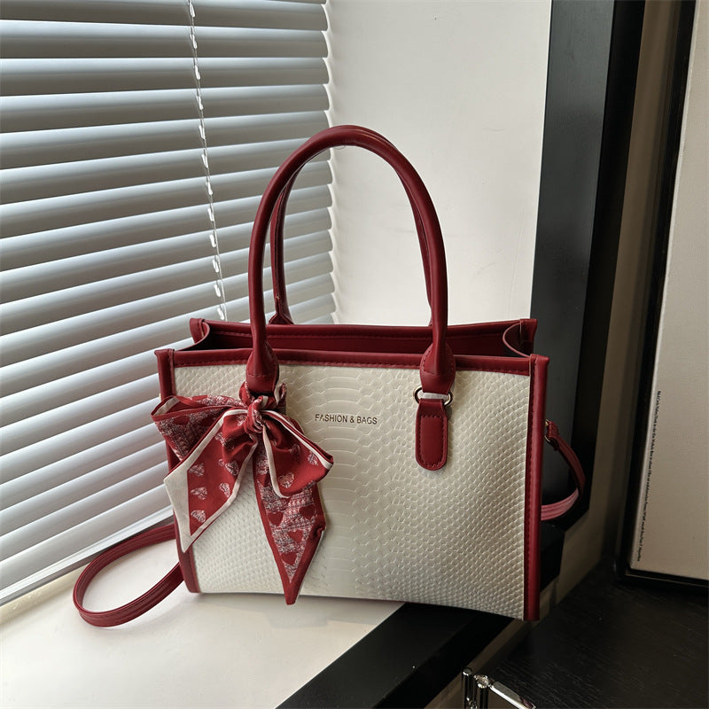 Damen stilvolle Handtasche mit geflochtenem Design und dekorativem Schleifenband Nord Taschen