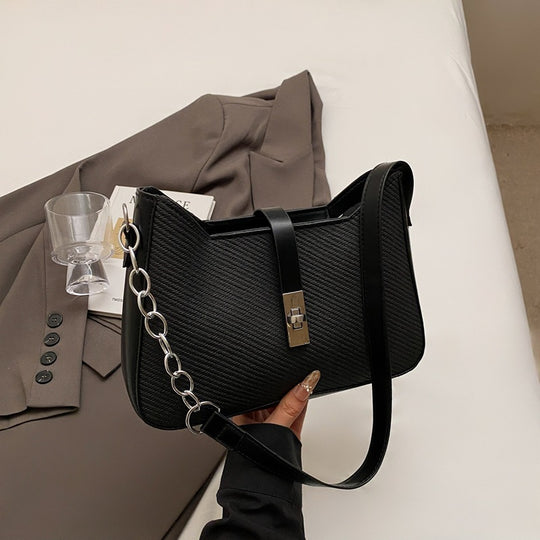 Damen stylische Umhängetasche mit geprägtem Design und dekorativer Kettenverzierung Nord Taschen