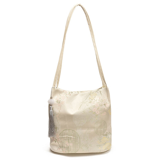 Damen Hobo-Tasche mit elegantem floralem Design und dekorativem Quastenanhänger Nord Taschen