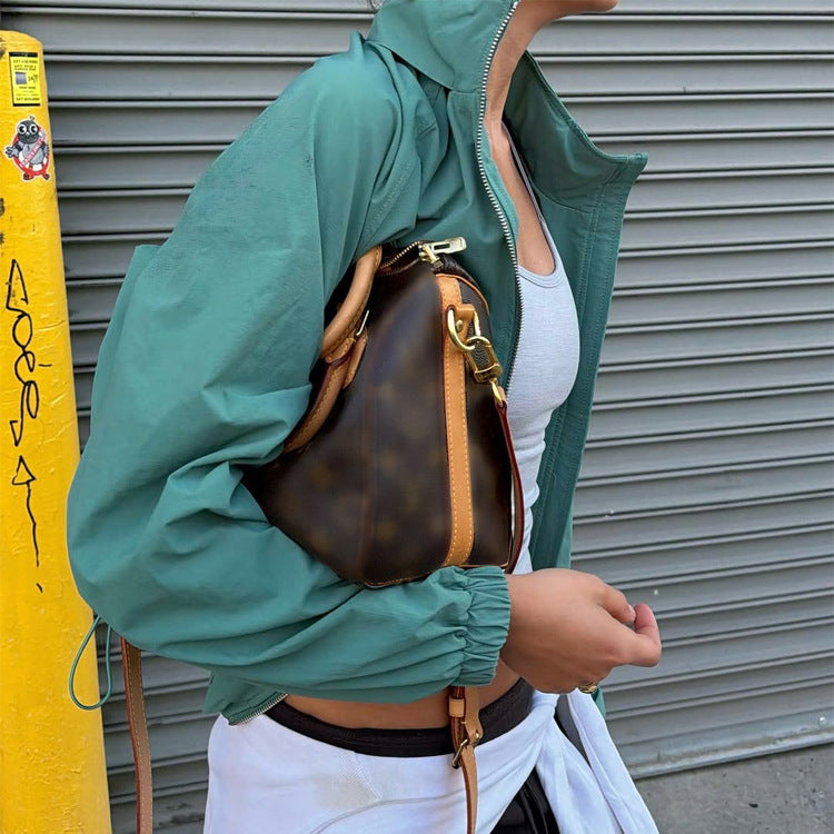 Damen Sportlich-urbaner Windbreaker mit kurzem Cropped-Schnitt, hohem Stehkragen und elastischen Bündchen Nord Taschen