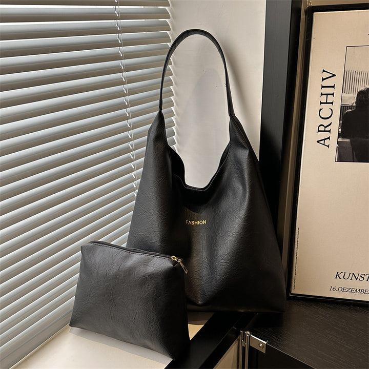 Damen elegante Umhängetasche aus kunstleder mit einer passenden Kosmetiktasche Nord Taschen