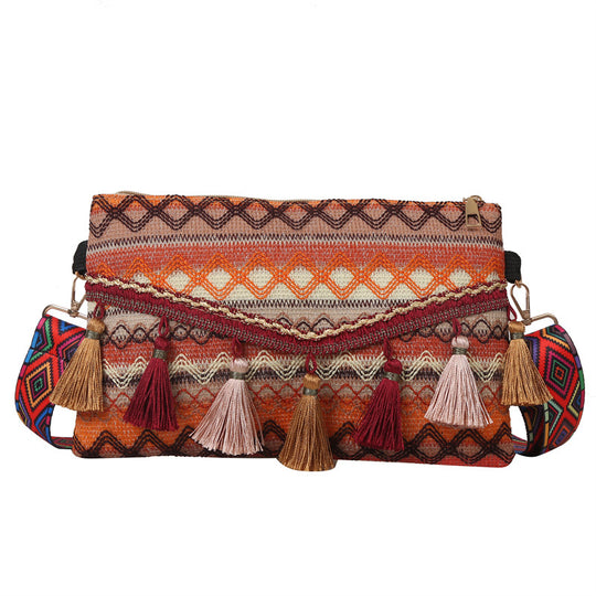 Damen modische Clutch-Tasche mit fransigen Akzenten und buntem Stickmuster Nord Taschen