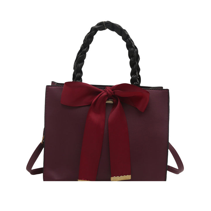 Damen elegante Handtasche mit geflochtenem Ledergriff und Schleifenakzent Nord Taschen