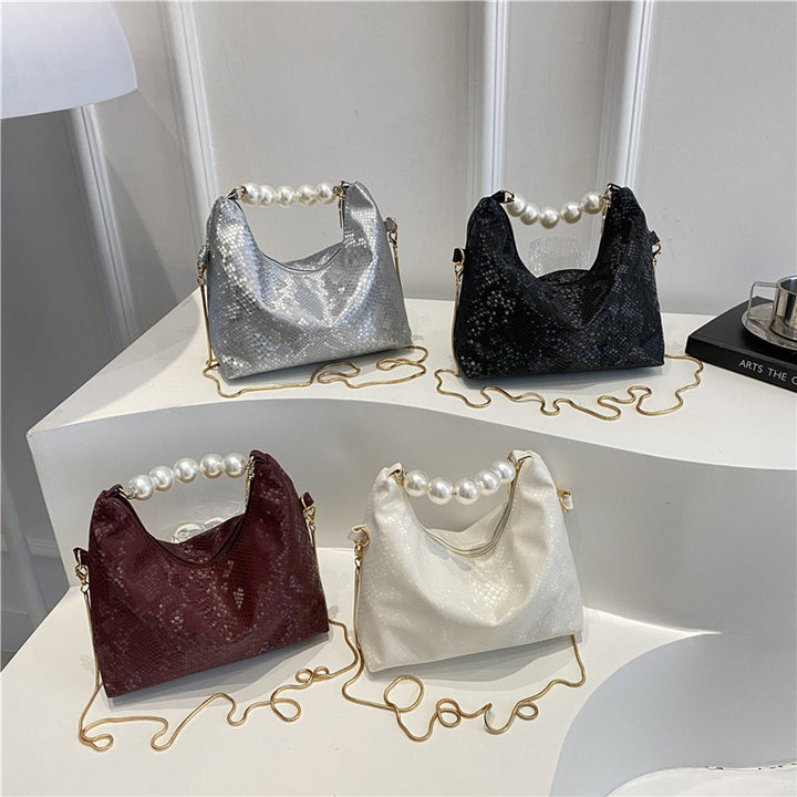 Damen Umhängetasche mit Perlenhenkel und eleganter Schlangenprägung Nord Taschen