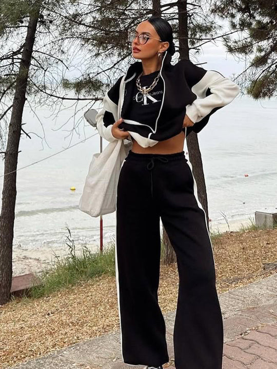 Damen athletisches Zweiteiler-Set aus strukturiertem Sweatstoff mit gekürzter Reißverschlussjacke und hochgeschnittener Jogginghose mit weitem Beinverlauf Nord Taschen