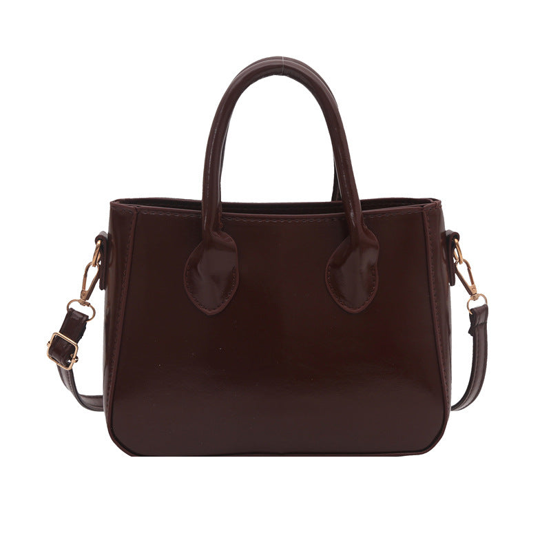 Damen elegante Handtasche aus glänzendem Kunstleder Nord Taschen