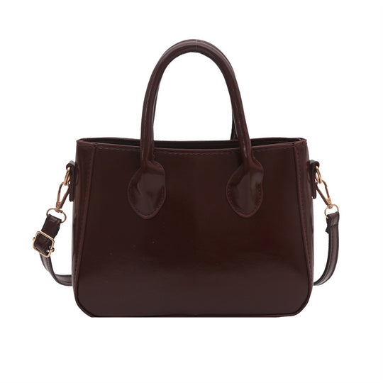 Damen elegante Handtasche aus glänzendem Kunstleder Nord Taschen