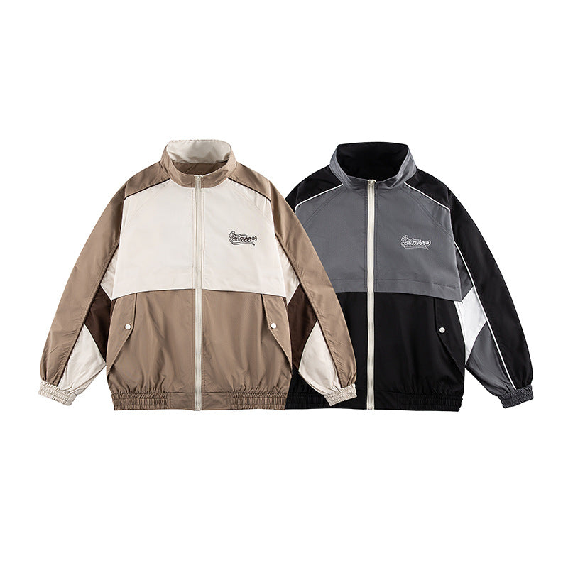 Unisex Kastig geschnittene Trackjacke im Retro-Sportstil mit hohem Stehkragen, Farbblock‑Einsätzen und elastischem Saum Nord Taschen