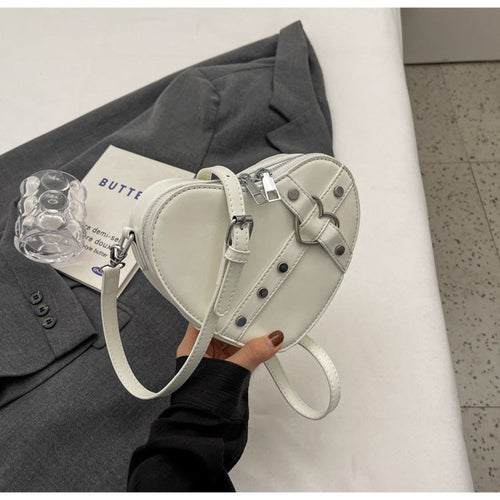 Nord Taschen | Umhängetasche für Damen - Herzförmige Crossbody-Tasche im auffälligen Design mit Riemenverschluss