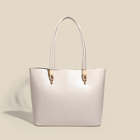 Damen Elegante Handtasche mit hochglänzender Oberfläche und goldenen Details Nord Taschen