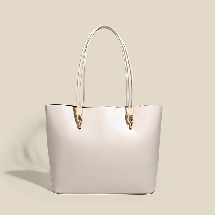 Damen Elegante Handtasche mit hochglänzender Oberfläche und goldenen Details Nord Taschen