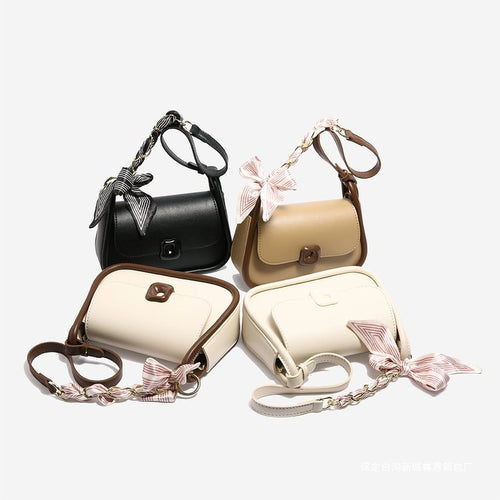 Damen Umhängetasche mit modischem Schleifenakzent und eleganter Struktur Nord Taschen
