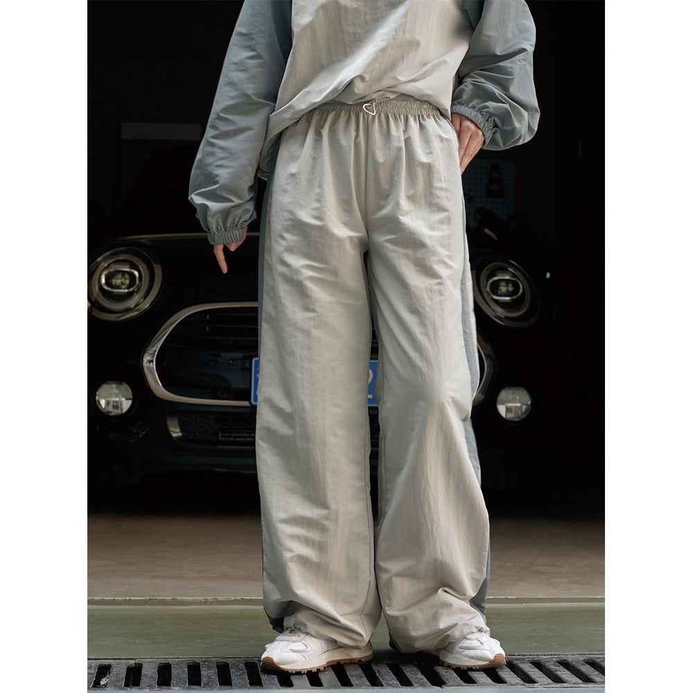 Damen Weite High‑Waist Trackhose im Palazzoschnitt mit kontrastierendem Seitenstreifen Nord Taschen
