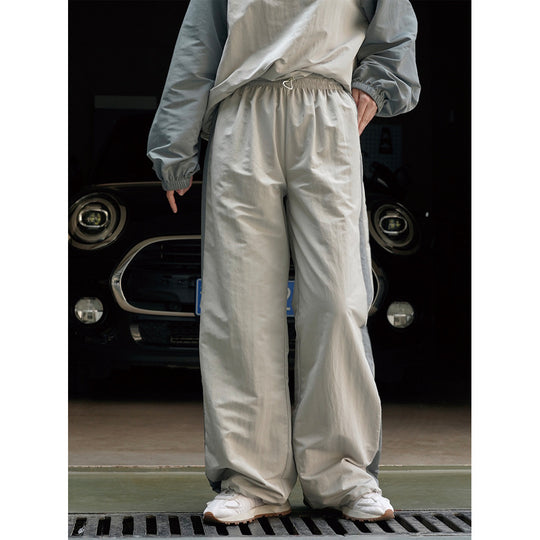 Damen Weite High‑Waist Trackhose im Palazzoschnitt mit kontrastierendem Seitenstreifen Nord Taschen