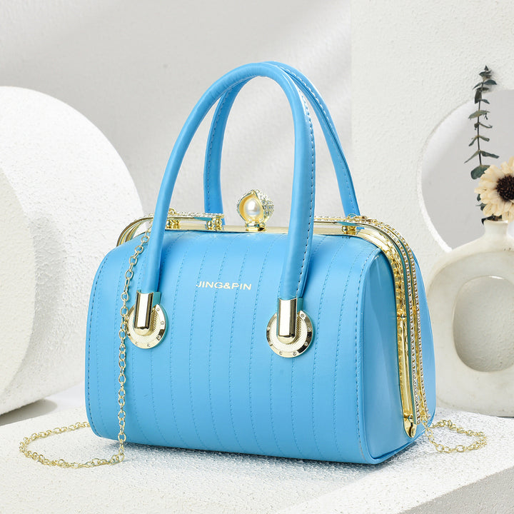 Damen elegante Handtasche im modernen Design mit goldenen Details Nord Taschen