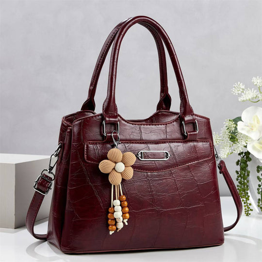 Damen Handtasche mit stilvollem Kroko-Design und abnehmbarem Blumenanhänger Nord Taschen