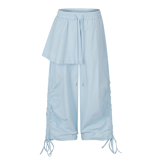 Damen Weite Capri-Hose mit Tunnelzug, seitlicher Raffung und asymmetrischer Überlagerung Nord Taschen