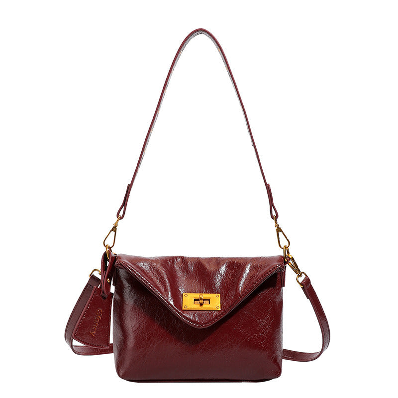Damen Umhängetasche mit strukturierter Oberfläche und elegantem Drehverschluss Nord Taschen