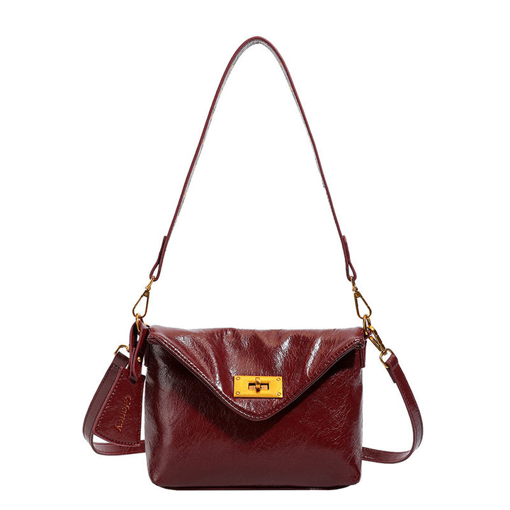 Damen Umhängetasche mit strukturierter Oberfläche und elegantem Drehverschluss Nord Taschen