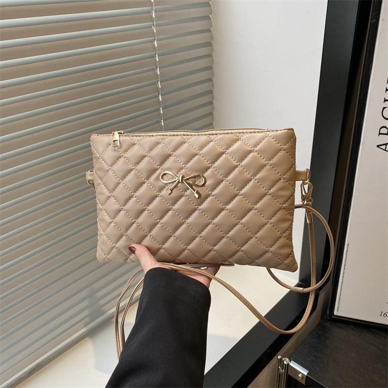 Damen elegante Clutch mit elegantem Steppmuster und zierlichem Schleifenakzent Nord Taschen