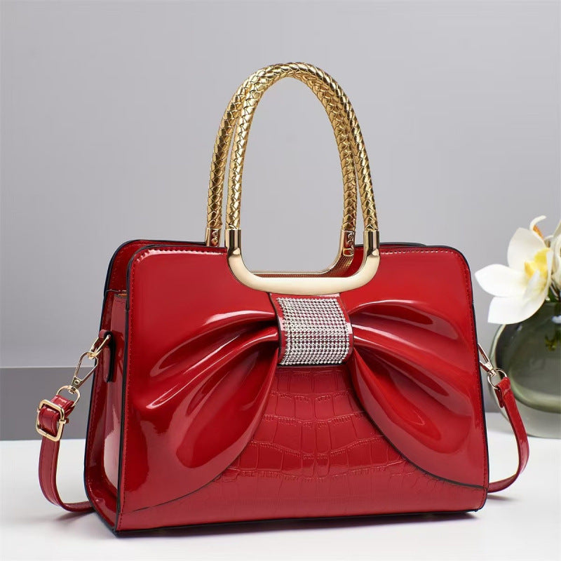 Damen Designer-Handtasche mit schimmerndem Schleifenakzent Nord Taschen