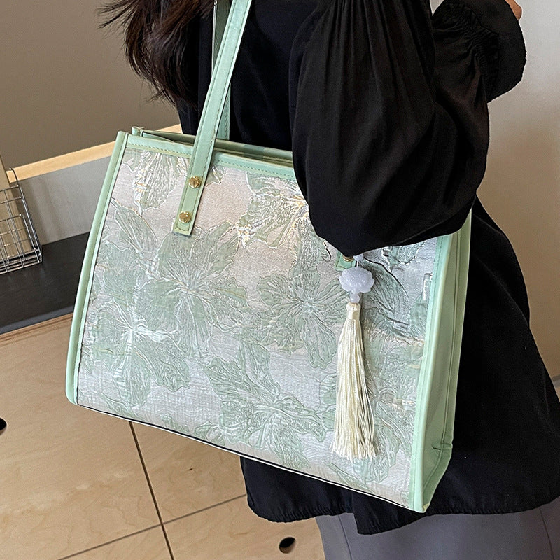 Damen Tragetasche mit floralem Stickdesign und elegantem Quastenanhänger Nord Taschen