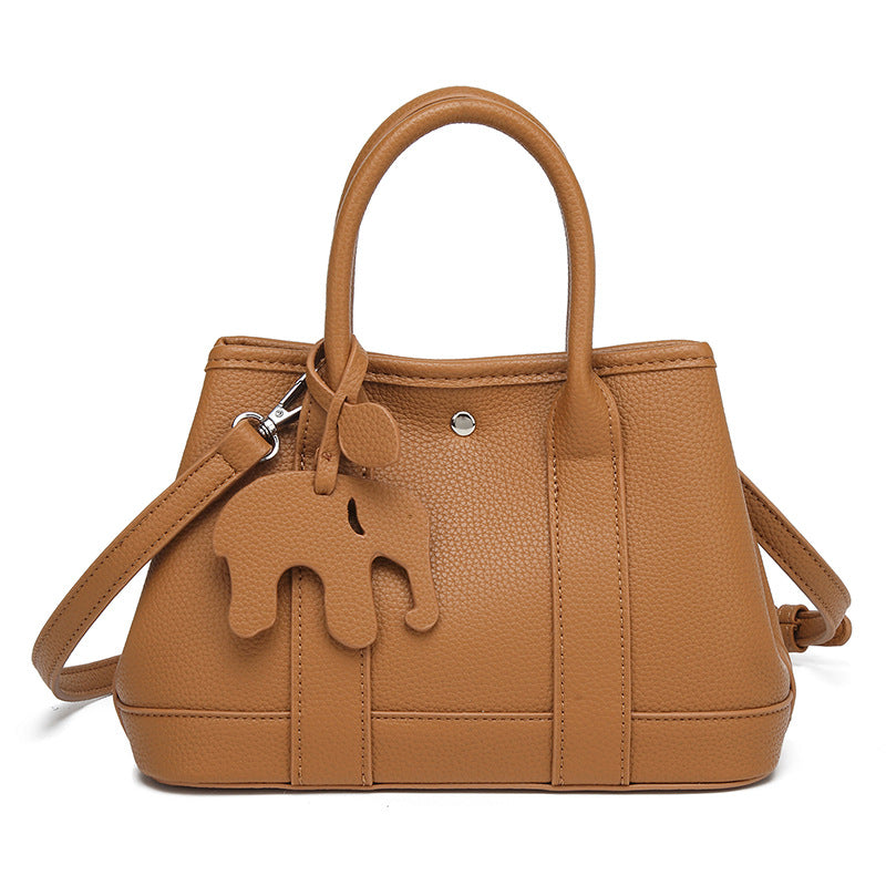 Damen Handtasche mit abnehmbarem Elefantenanhänger und elegantem Kunstleder Nord Taschen