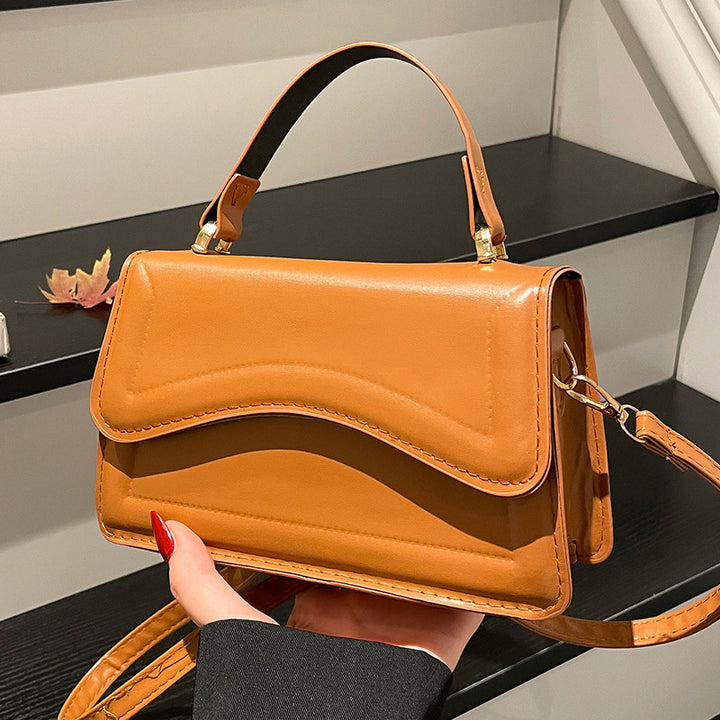Damen elegante Handtasche mit geschwungenem Design Nord Taschen