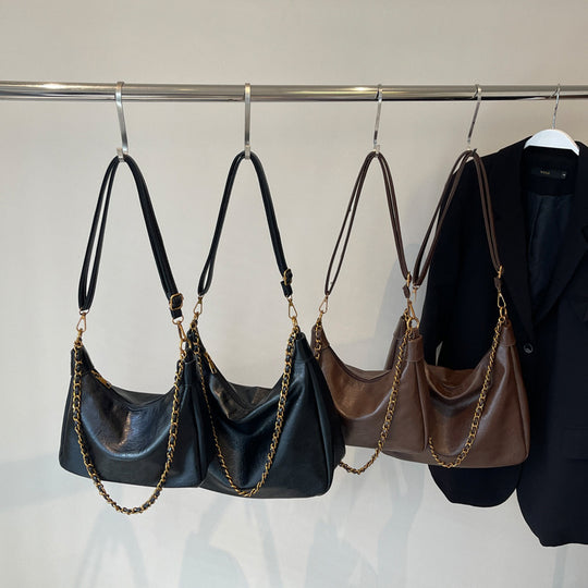 Damen stylische Umhängetasche mit goldenen Kettendetails Nord Taschen