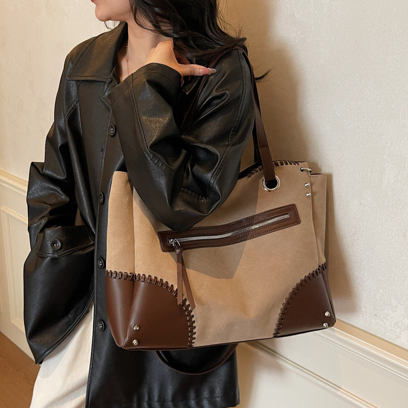 Damen elegante Handtasche mit offenen Seiten und dezenten Lederdetails Nord Taschen
