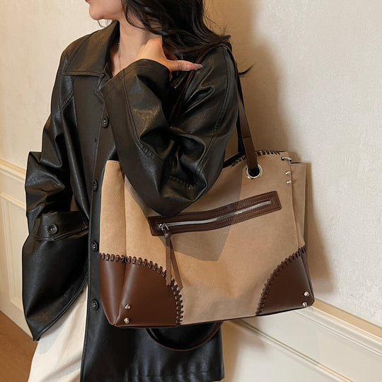 Damen elegante Handtasche mit offenen Seiten und dezenten Lederdetails Nord Taschen