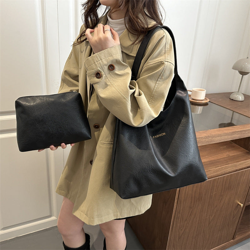 Damen elegante Umhängetasche aus kunstleder mit einer passenden Kosmetiktasche Nord Taschen