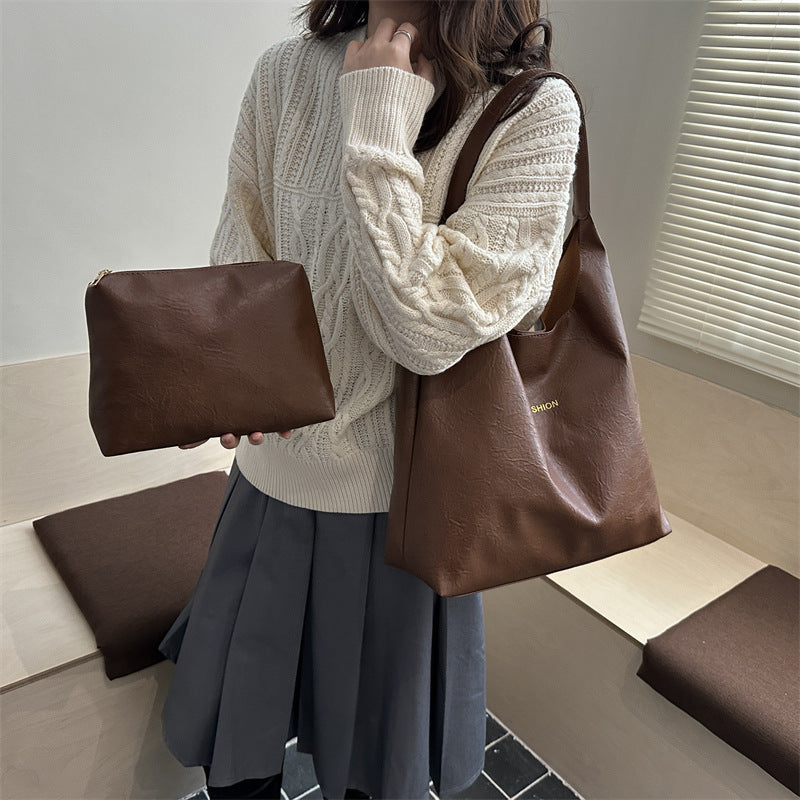 Damen elegante Umhängetasche aus kunstleder mit einer passenden Kosmetiktasche Nord Taschen