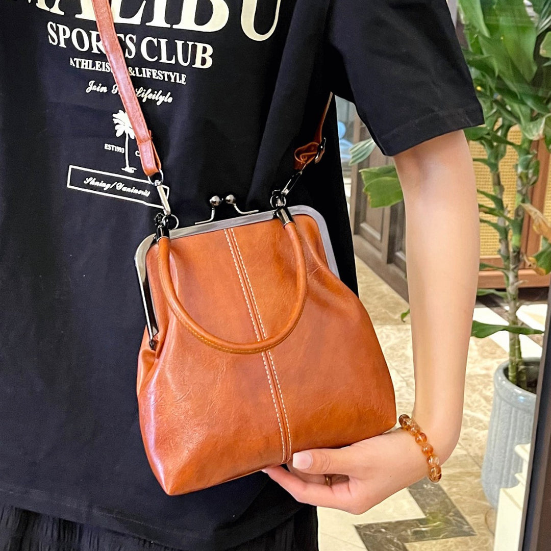 Damen elegante Handtasche mit robustem Metallverschluss Nord Taschen