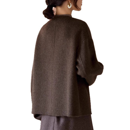 Damen Kurze Wollmix-Jacke mit Rundhalsausschnitt, Ballonärmeln und Knebelknöpfen Nord Taschen