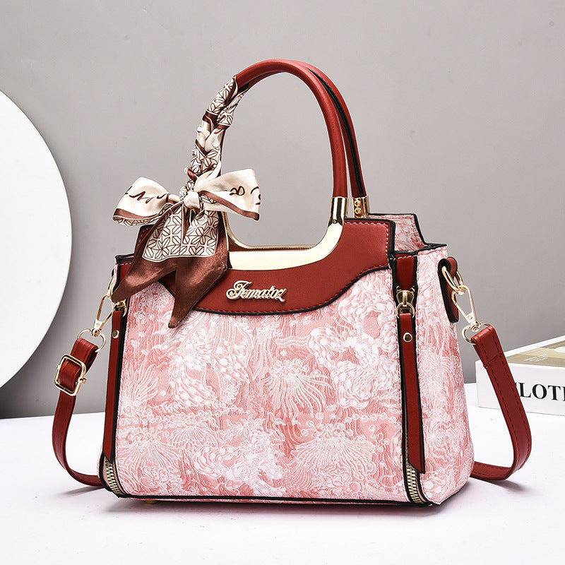 Damen elegante Handtasche mit floralem Design und Schmuckdetails Nord Taschen
