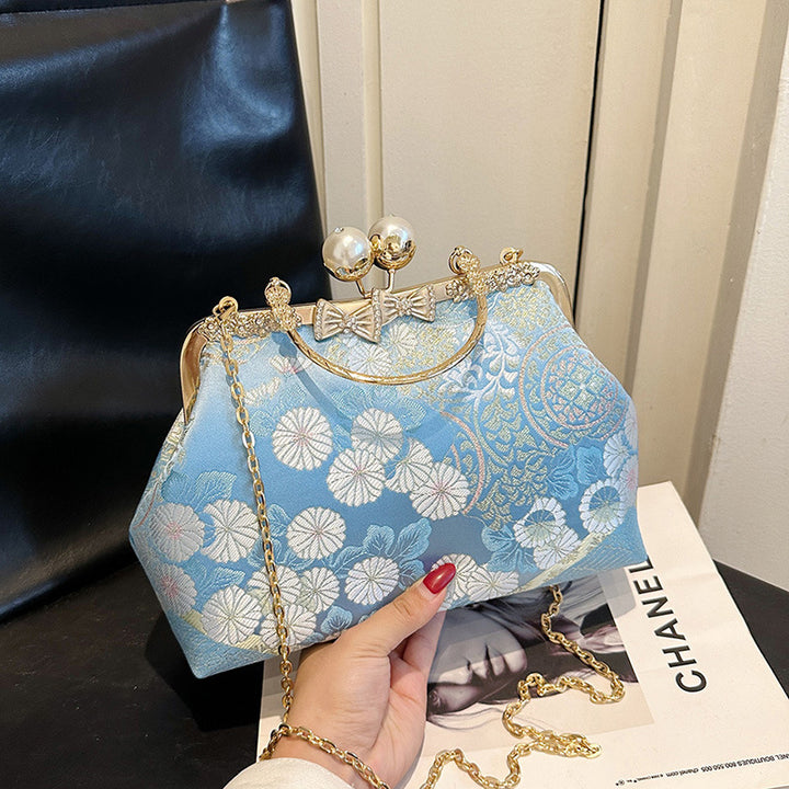 Damen elegante Umhängetasche mit floralem Design und Kunstlederakzenten Nord Taschen