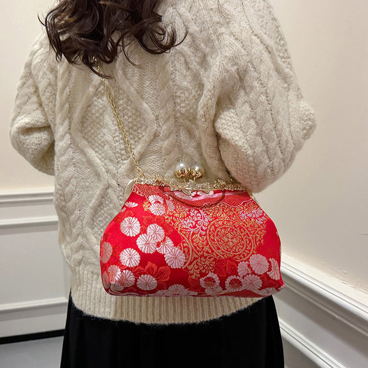 Damen elegante Umhängetasche mit floralem Design und Kunstlederakzenten Nord Taschen
